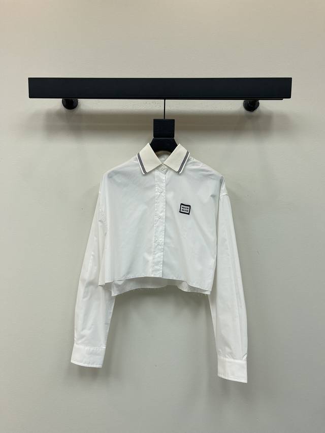 Miumi*25's new early fall collection features a webbing-embellished lapel, long-