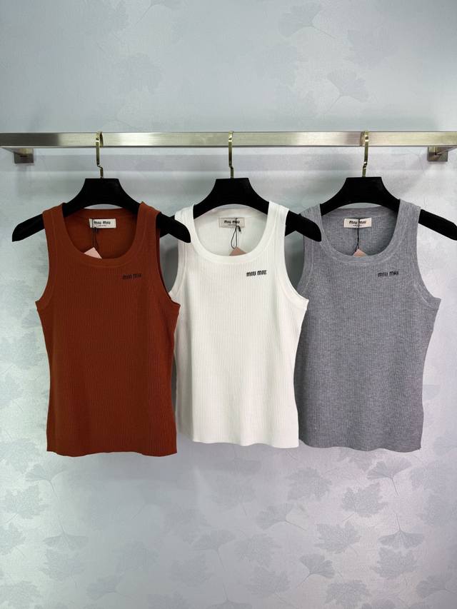 Miumi*'s latest Spring/Summer 2025 collection! This ribbed knit vest is custom-w