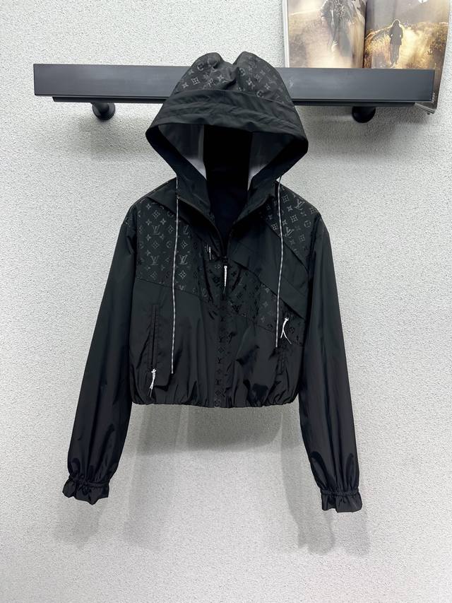 L's patchwork monogram hooded jacket. Made of a unique material with a textured