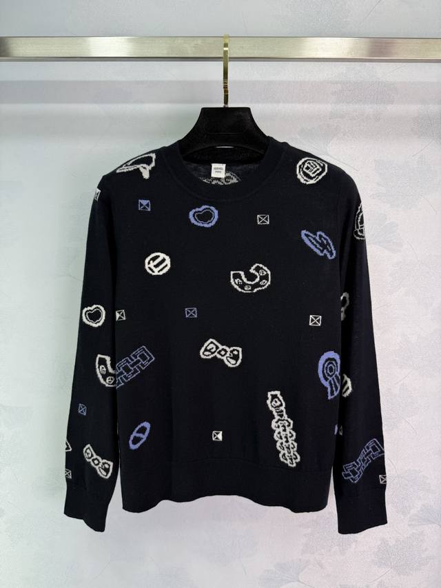 He*25's new early fall round-neck cashmere sweater, embellished with a white geo