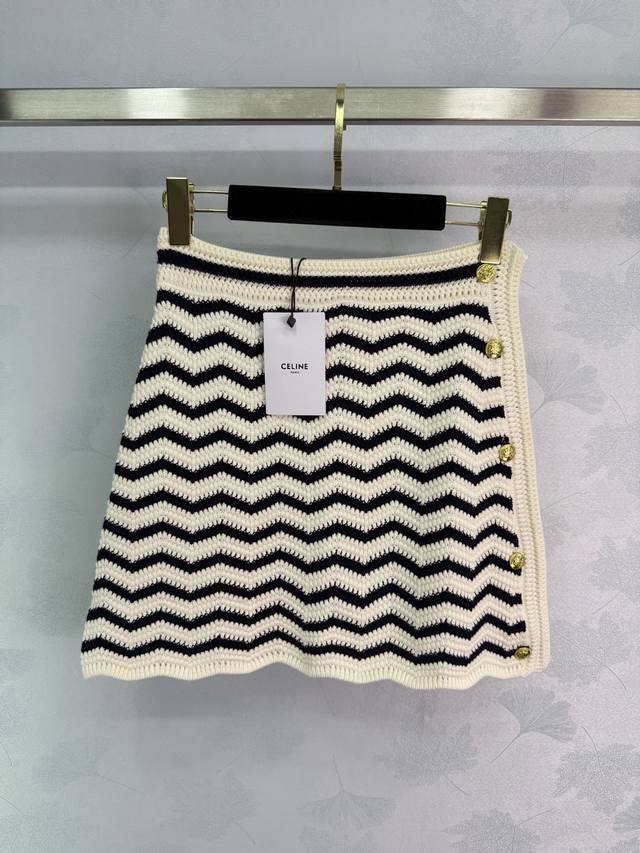 Celine's high-waisted, wave-striped knit skirt features a classic, timeless retr