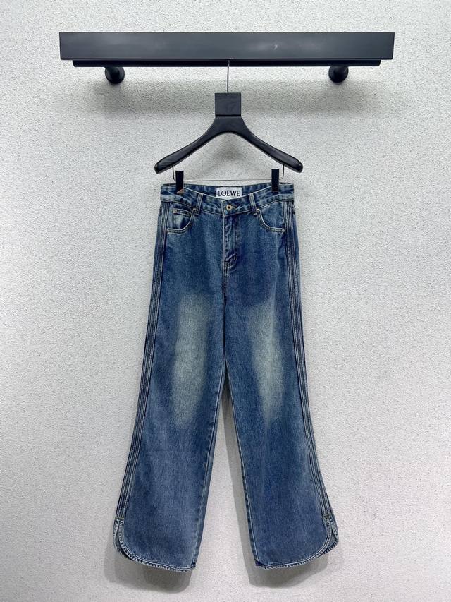Loewe slit denim trousers, featuring a unique slit design at the hem. Available