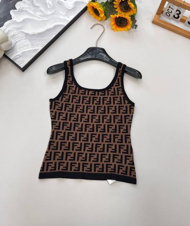 Logo monogram vest! I love this one, it's so chic! It might seem a bit old-fashi