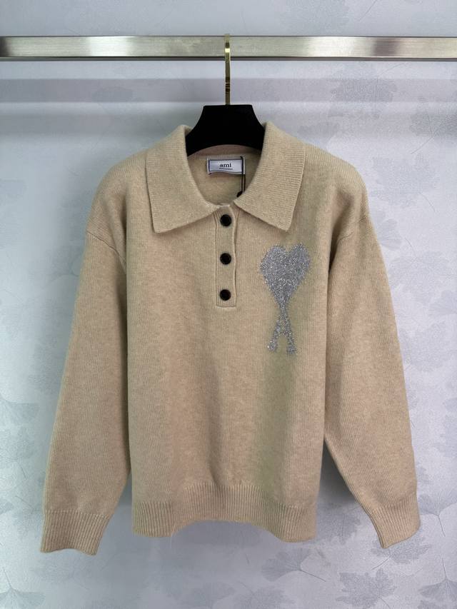 Ami*25 Early Fall Collection Heart Polo Neck Knit Top. Featuring a classic silve