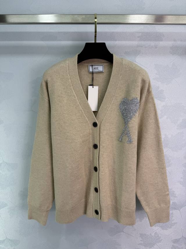 Ami*25 Early Fall Collection Heart V-neck Cardigan features a classic silver hea