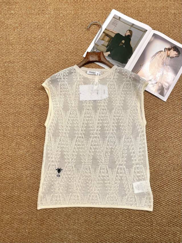 Dior's new knitted vest, in a soft apricot color with a soft light filter, has a
