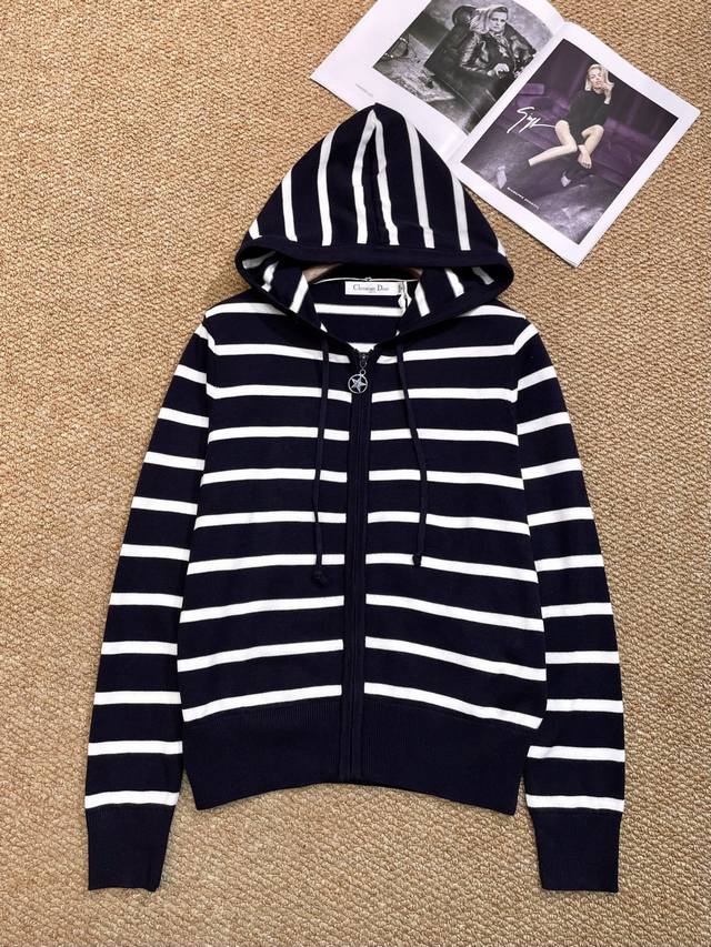 Dior's new coat features a hooded drawstring design for windproof warmth and an