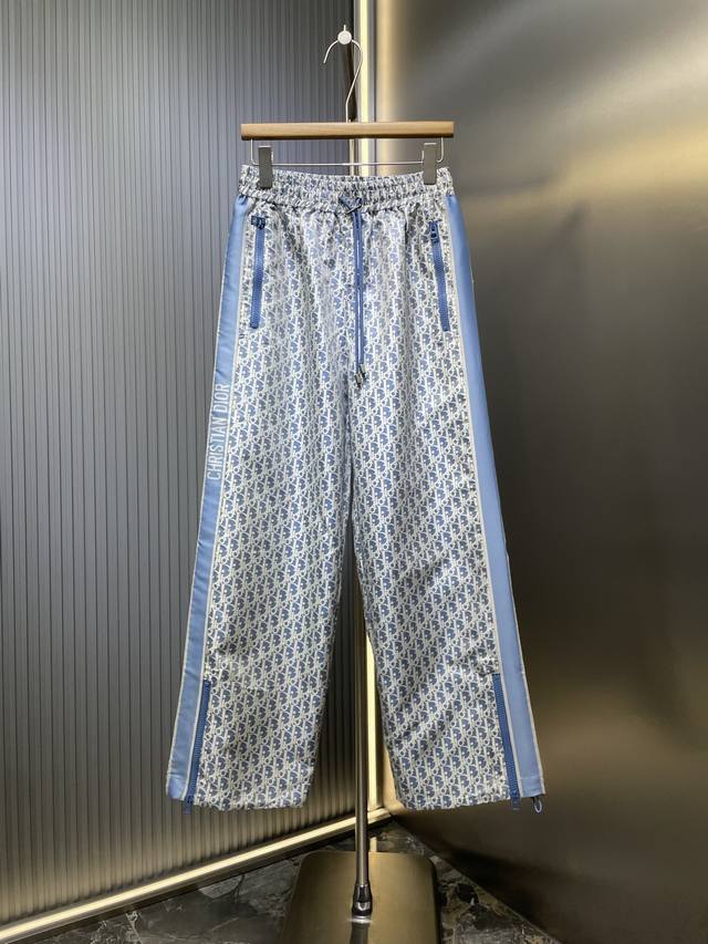 Dior top-of-the-line original monogram trousers. Logo webbing on the outside of