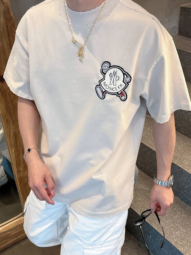 offers the latest Moncler Spring/Summer short-sleeved, crew-neck T-shirts, featu