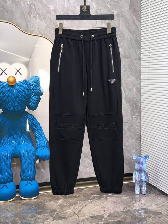Prada. These new spring 2025 casual pants offer a fresh interpretation of the ae