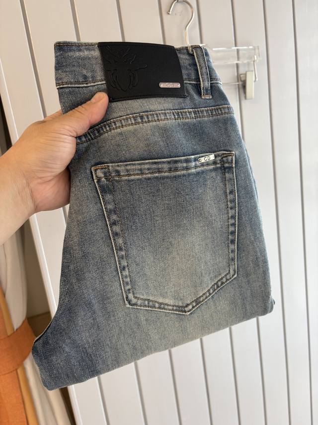 A pair of super stylish jeans, made of custom-made original washed denim fabric,