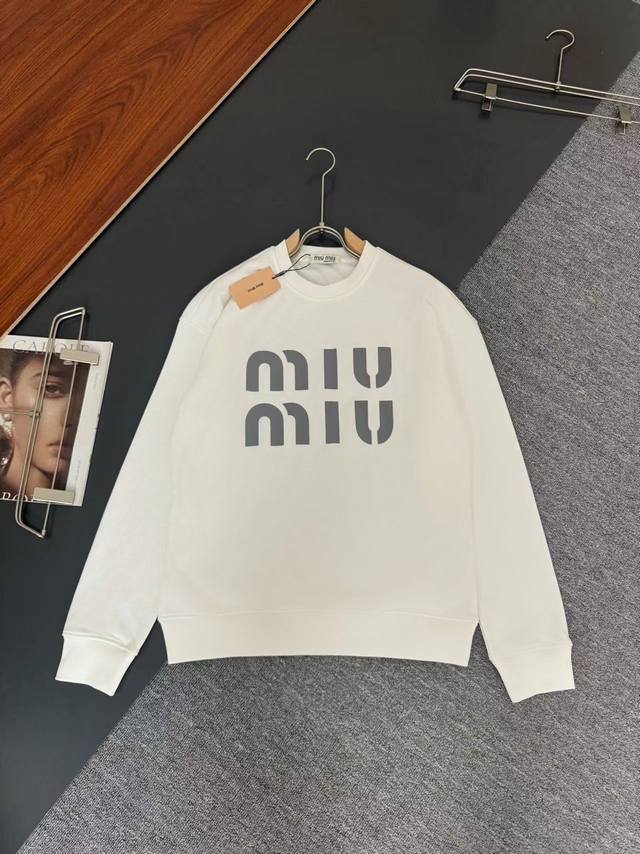Miu Miu*'s latest fall/winter round-neck, stylish long-sleeved sweatshirt, featu
