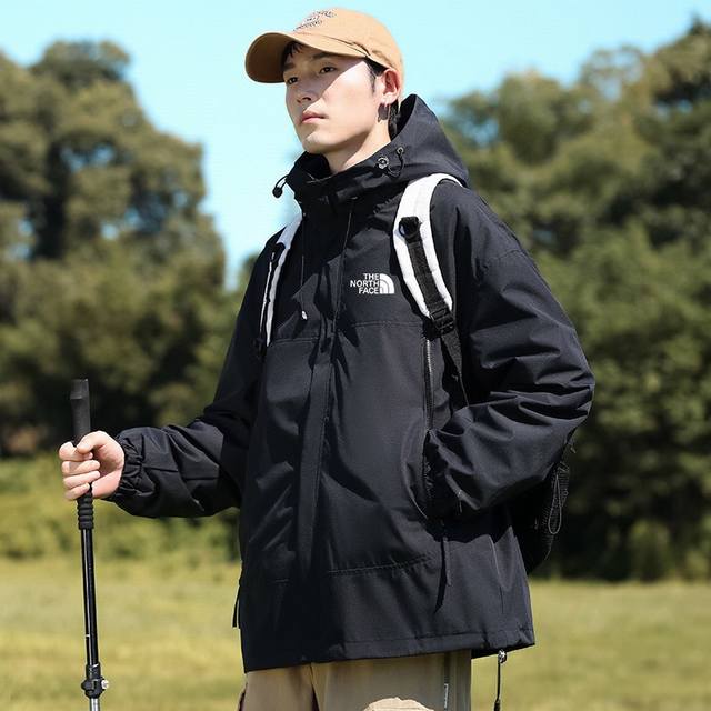 The North Face Waterproof Hooded Jacket, a unisex jacket featuring a matching c