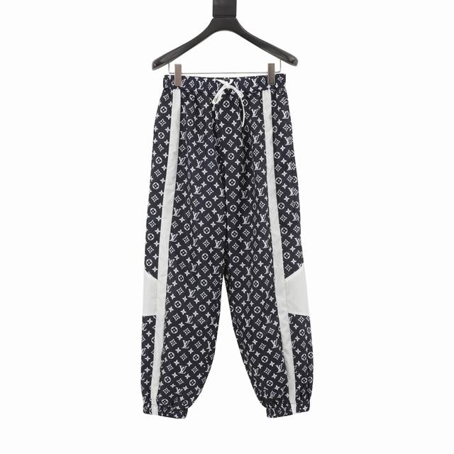 Louis Vuitton Monogram Print Tech Track Pants These track pants feature a techni