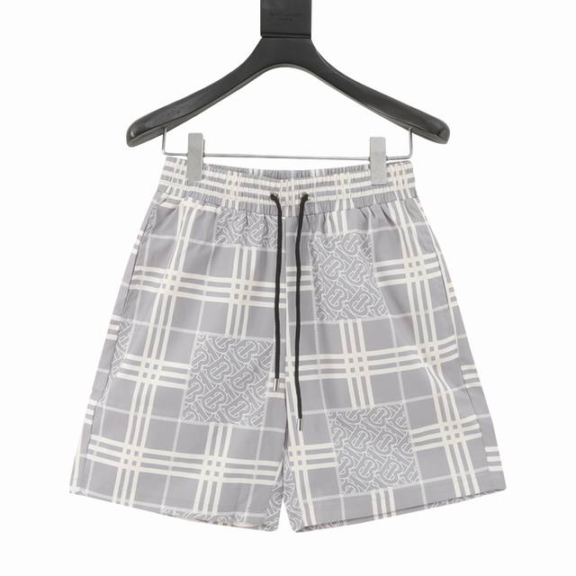 Burberry Classic Large Plaid Beach Shorts These shorts feature a thin design, en