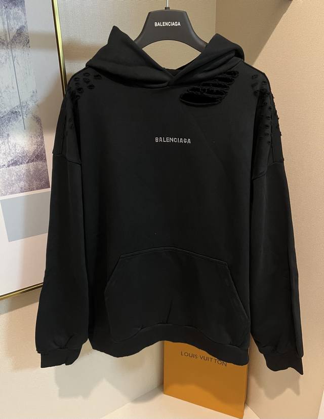 Sizes: XS SML. Black Balenciaga hooded ripped sweatshirt with rhinestones and le