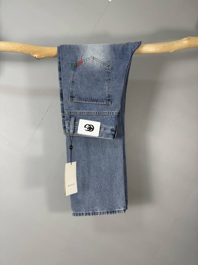 Gucci men's stylish wide-leg jeans, officially released as a brochure and poster