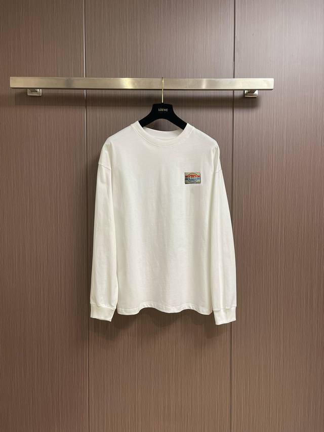 A casual, stylish cotton long-sleeved T-shirt with a small Gucci logo and lette