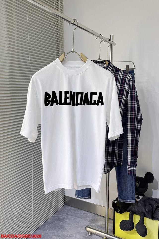 J828 Ba Balenciaga's new double-layer, heavily crafted, monogrammed short-sleeve