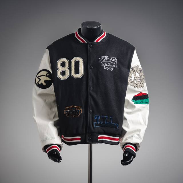 Stussy's three-way collaboration, a patchwork embroidered baseball jacket with