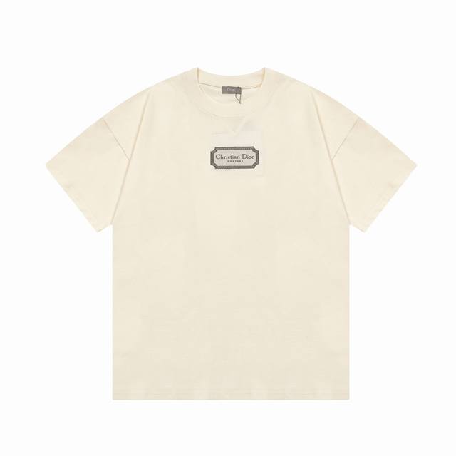 Dior's classic silver-framed embroidered logo is a refined upgrade, inspired by