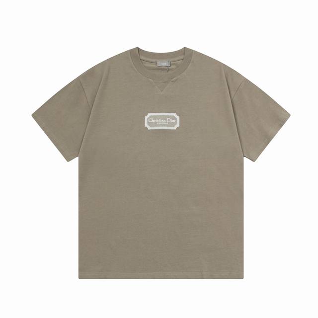 Dior's classic silver-framed embroidered logo is a refined upgrade, inspired by