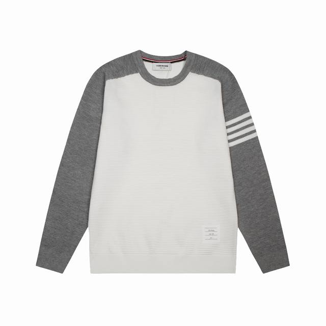 Thom Browne's colorblock four-bar knit polo shirt is an update, inspired by the