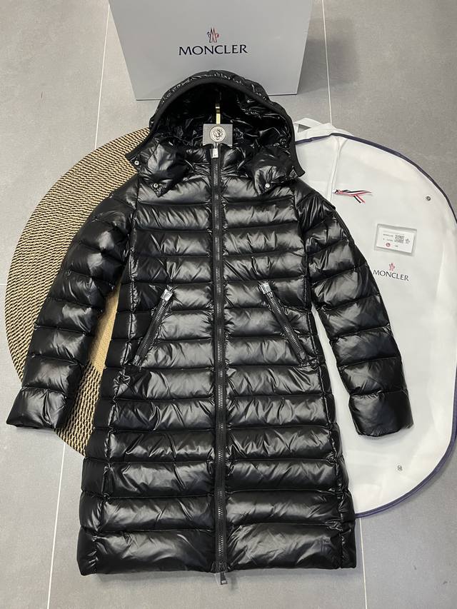 Moncler Long, Fitted Waist Down Jacket DDD. This long down jacket, worn by Yang