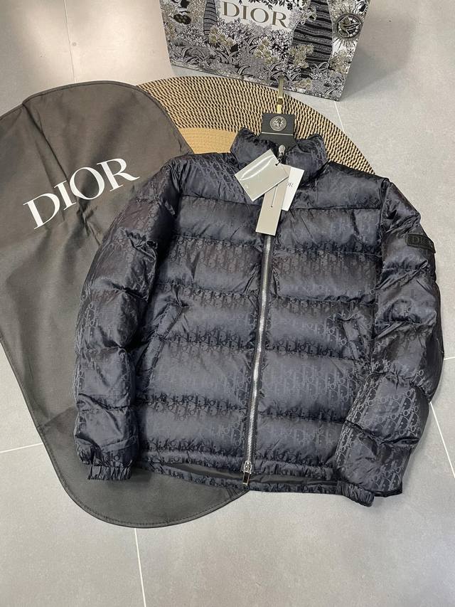 A navy blue Dior 23Fw Oblique stand-up collar down jacket, the same style as th