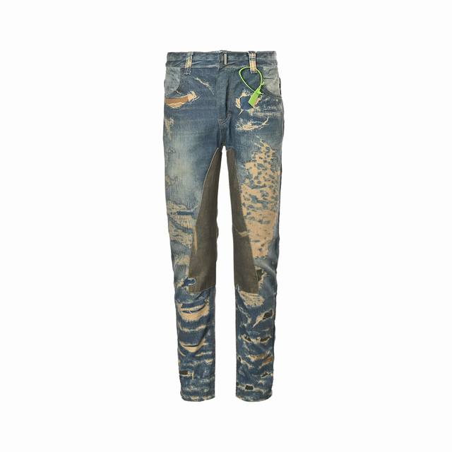 Givenchy's Destroyed Jeans feature a cracked effect, continuing the signature cr