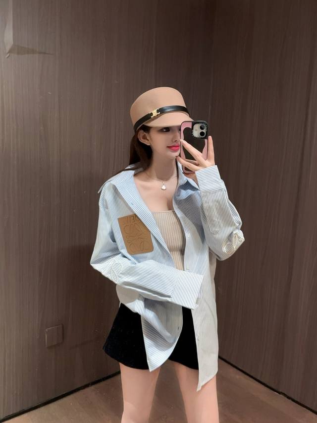 Loewe's new 25Ss shirt features a fresh, sky-blue striped oversized shirt with a