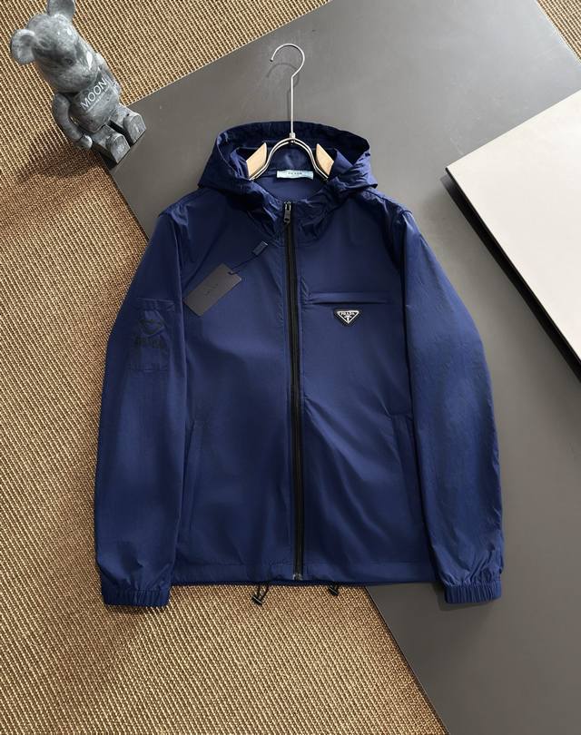 Pins Prada's classic functional casual jacket features a waterproof zipper desig