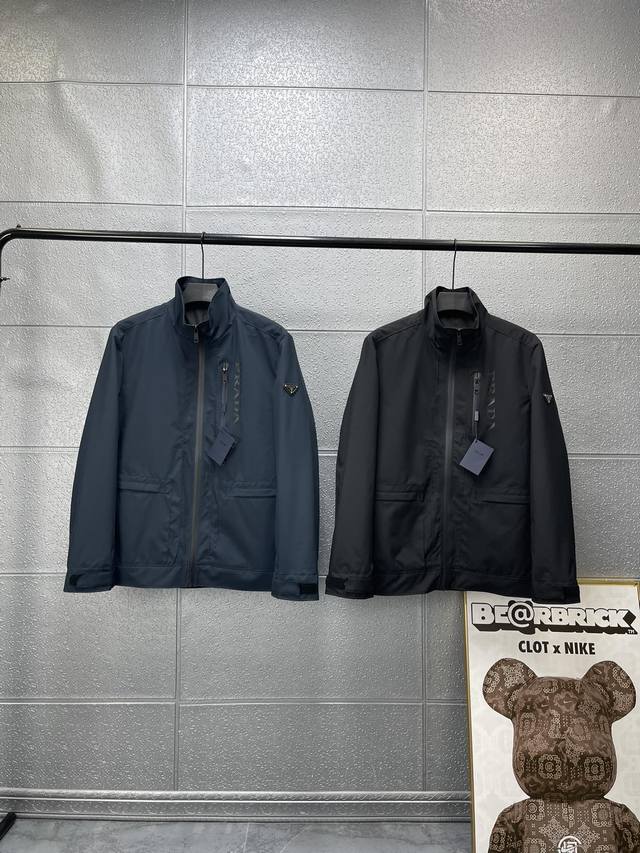 Pra*A New Men's Jacket with Triangle Logo and Stand-Up Collar. Over 10,000 in st