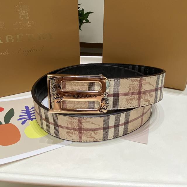 Burberry's classic embossed belt features a gold-plated logo buckle. This styli