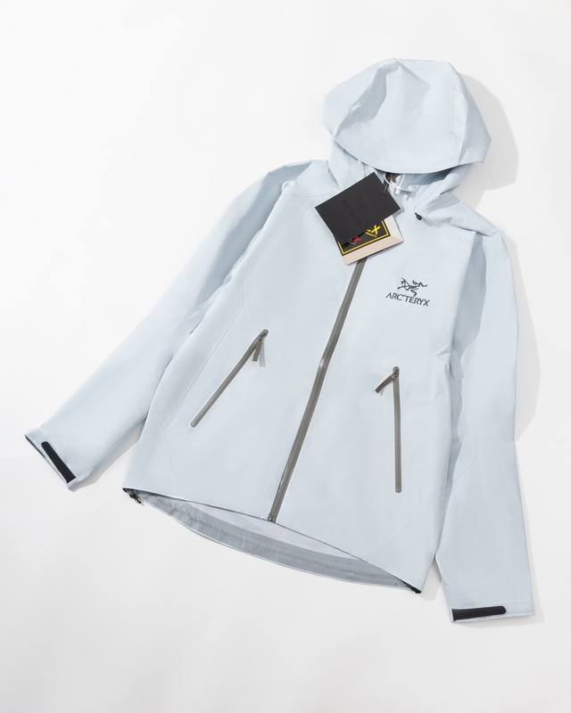 Top-of-the-line Arc'Teryx Beta Lt Gore-Tex Jacket in Ether Blue and white, model