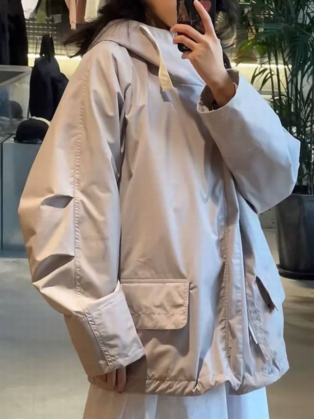 Model Image Nanamica Hooded Deck Jacket, a hooded, windproof, and waterproof M51