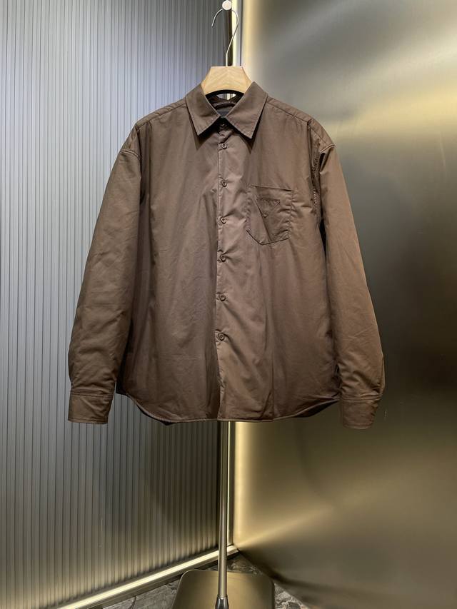 Prada's new 25 triangle-label nylon lapel quilted jacket is made from 100% eco-f
