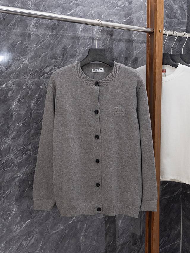 Style No. J015 Miumiu Miu classic jacket with small embroidered logo on the che