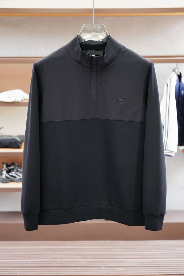 Prada Autumn 2025 Collection. This sweatshirt, crafted from a clean cotton knit,