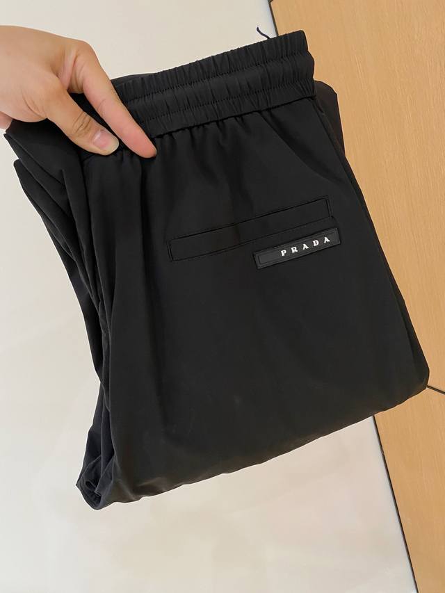 Prada's new men's casual pants for fall/winter 2025. Made from premium fabrics,