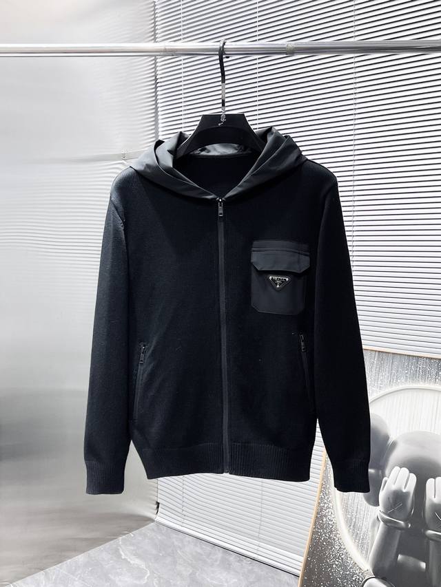 Prada's new Fall/Winter 2025 collection features a wool blend hooded long-sleeve