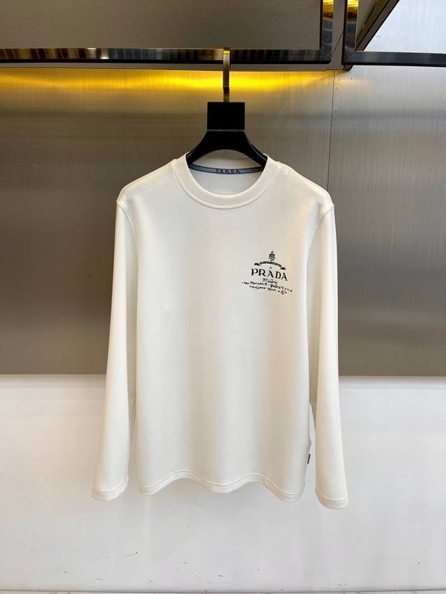 Prad, 2025 Fall/Winter long-sleeved T-shirt and sweatshirt. The gold-stamped cro