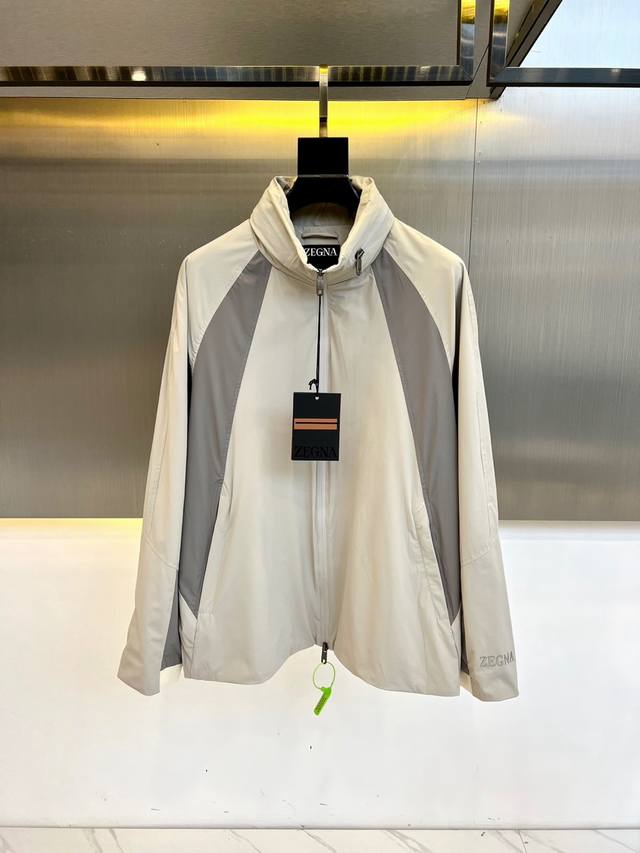 Zegna, 25 colorblock zippered micro-logo stand-up collar trench coat. Zipper clo
