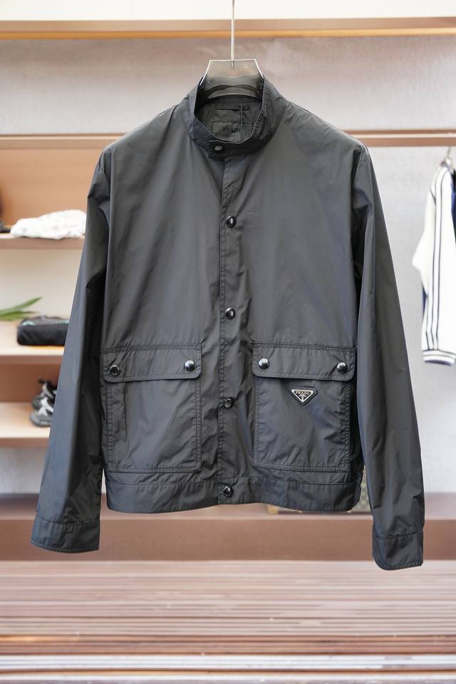 Prada - New Spring/Summer 25 Pr*Da jacket with a metal triangle logo and a small