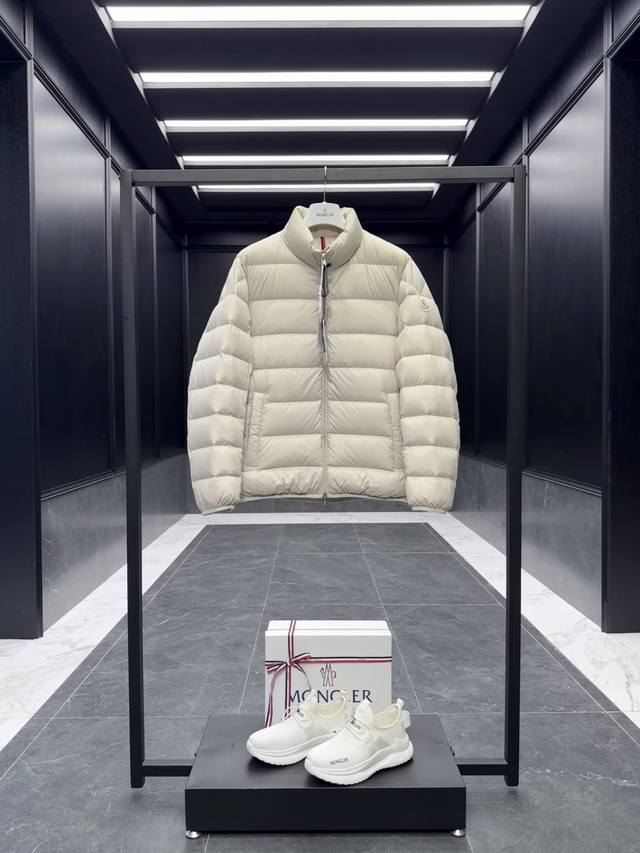 Moncler Baudinet men's cropped down jacket with a stand-up collar. Made from pr