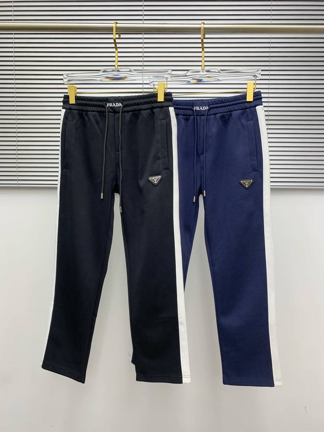 Prada's new fall/winter 2025 casual pants (DDD) feature classic 3D embroidered l