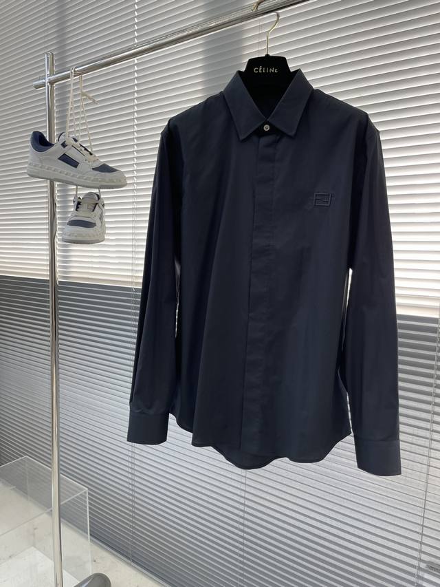 Fend poplin shirt with double Ff embroidery details. Concealed button-style shel