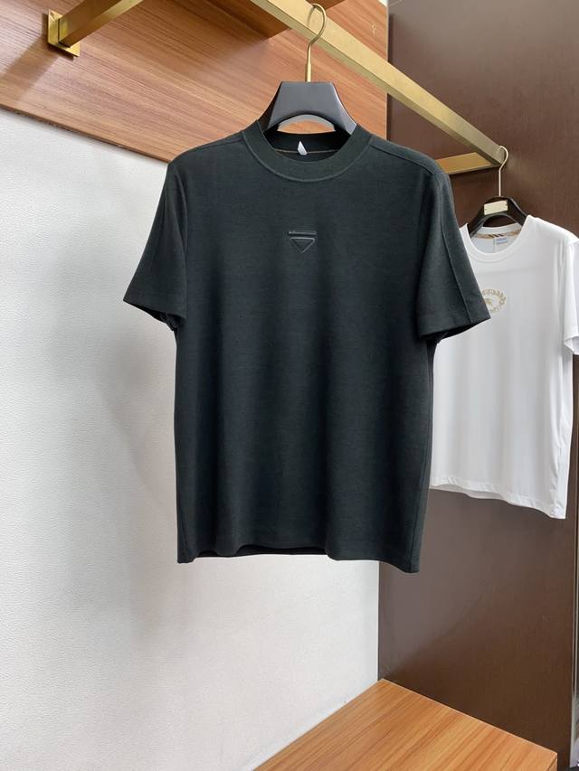 Prada's new fall/winter 2025 collection features a stylish, casual short-sleeved