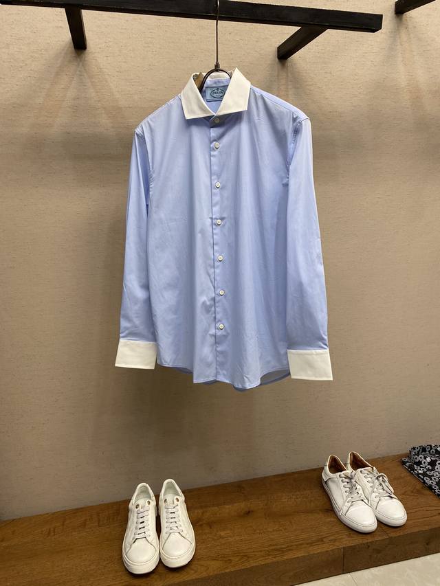 Prada, a stylish and minimalist long-sleeved shirt. This lightweight cotton shir