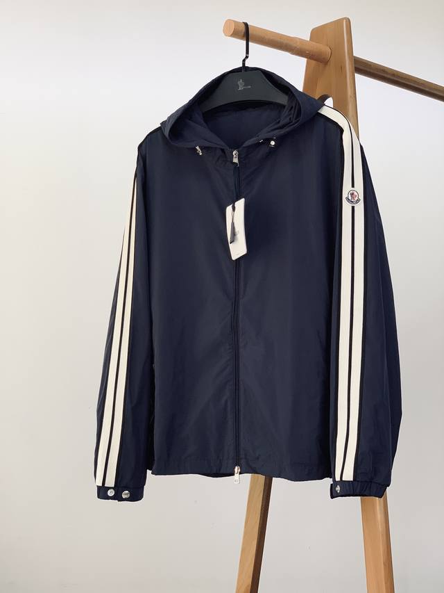 Moncler's Olan hooded lightweight jacket, a new arrival for early fall 2025. The